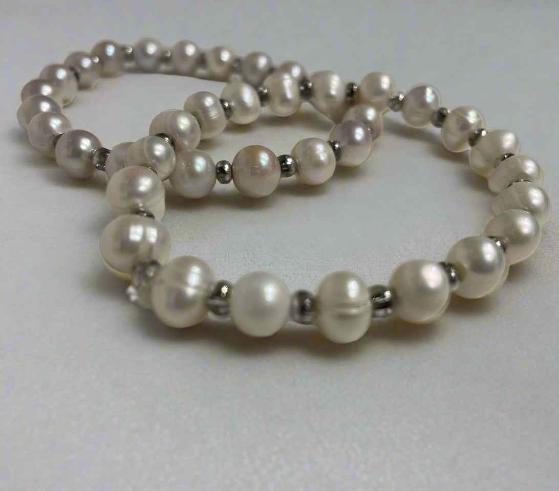 white pearl bracelet with silver spacer