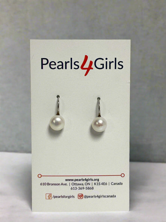 Pearl high-heel drop earrings on a 'Pearls 4 Girls' branded card against a light gray background